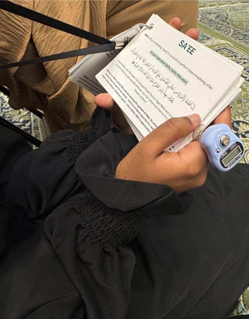 Close-up of the Sa'ee page inside the Umrah Mini-Guide, showing dua in Arabic and transliteration